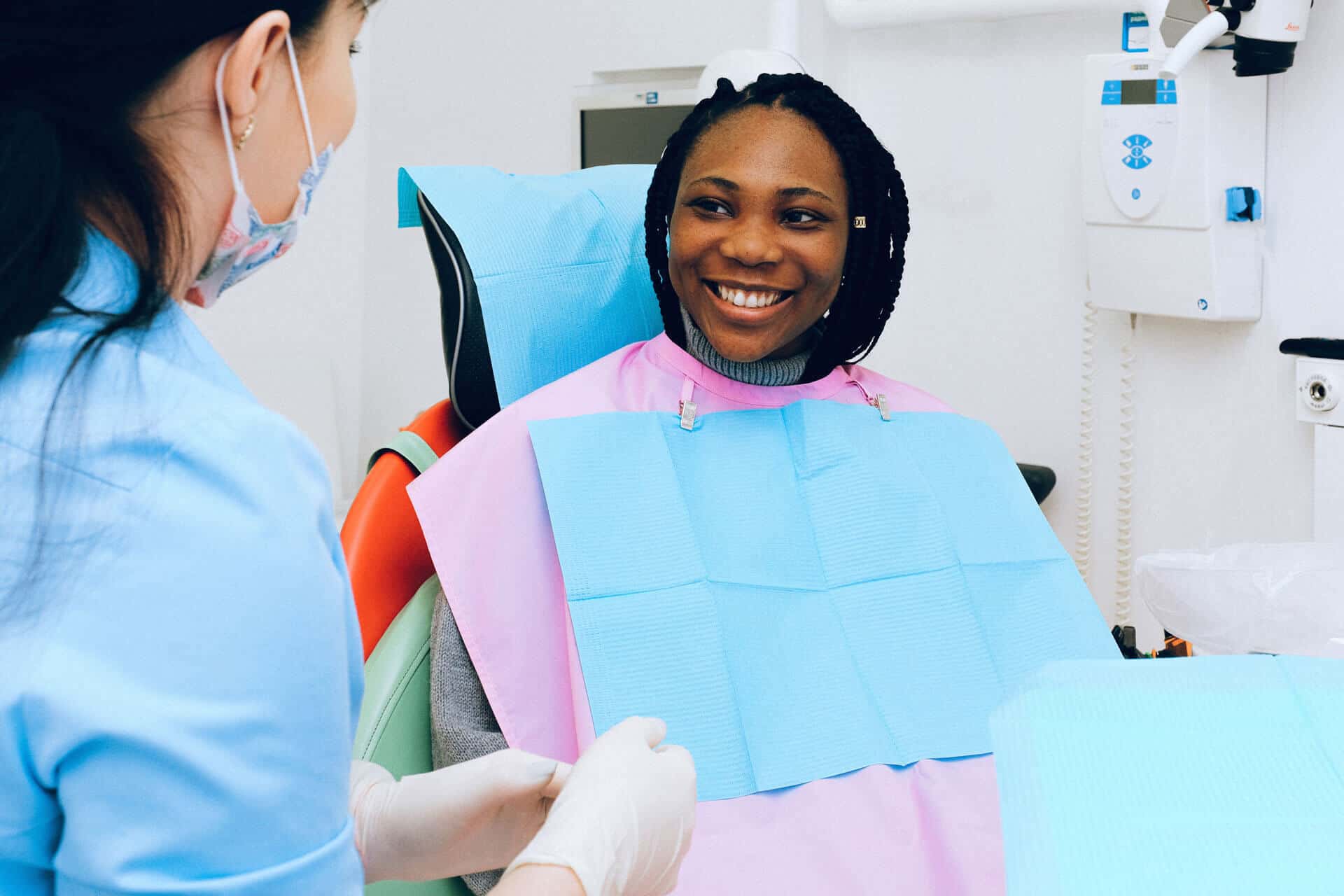 dentist operating wisdom teeth removal to a patient