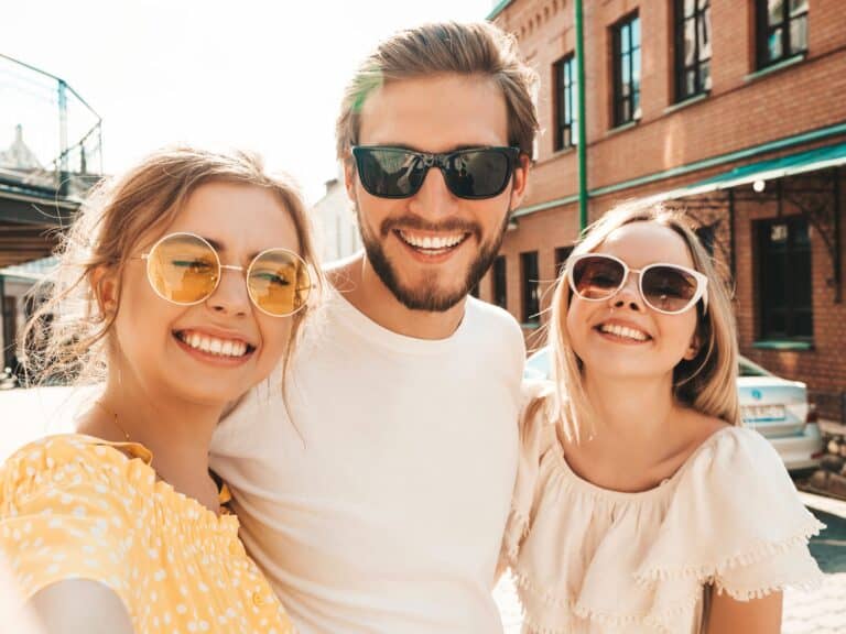 group of friends keeping smile bright and healthy this summer