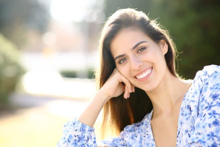 young woman showing her perfect smile in The Woodlands